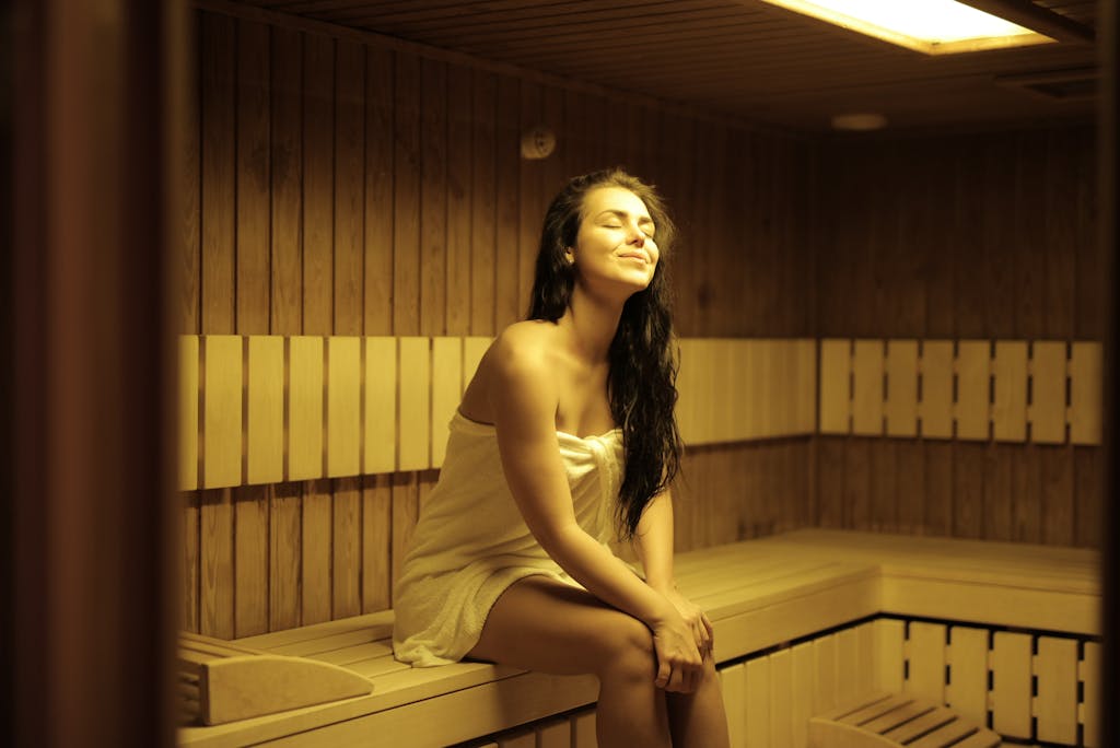 Beautiful Woman Sitting in Sauna